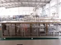 Envasadora de bolsas prefabricadas, llenado con 4 boquillas